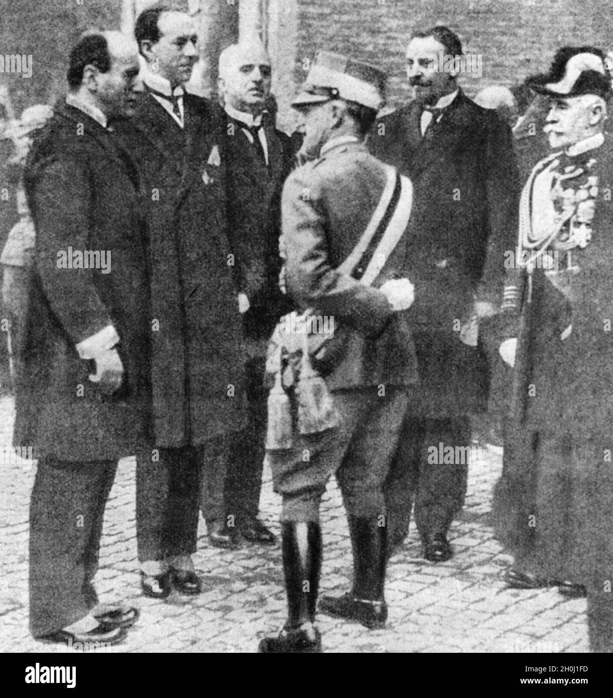 'The King of Italy, Victor Emmanuel III. (center), met publicly with Benito Mussolini on November 4, 1922. The King had appointed him as the new Prime Minister at the end of October, after the latter had previously threatened a coup d'état through his ''March on Rome''. Next to them are some ministers of the new government: Aldo Finzi (Secretary of State for the Interior, left), probably Gabriello Carnazza (Minister of Public Works, right) and Grand Admiral Paolo Thaon di Revel (Minister of the Navy, far right). [automated translation]' Stock Photo