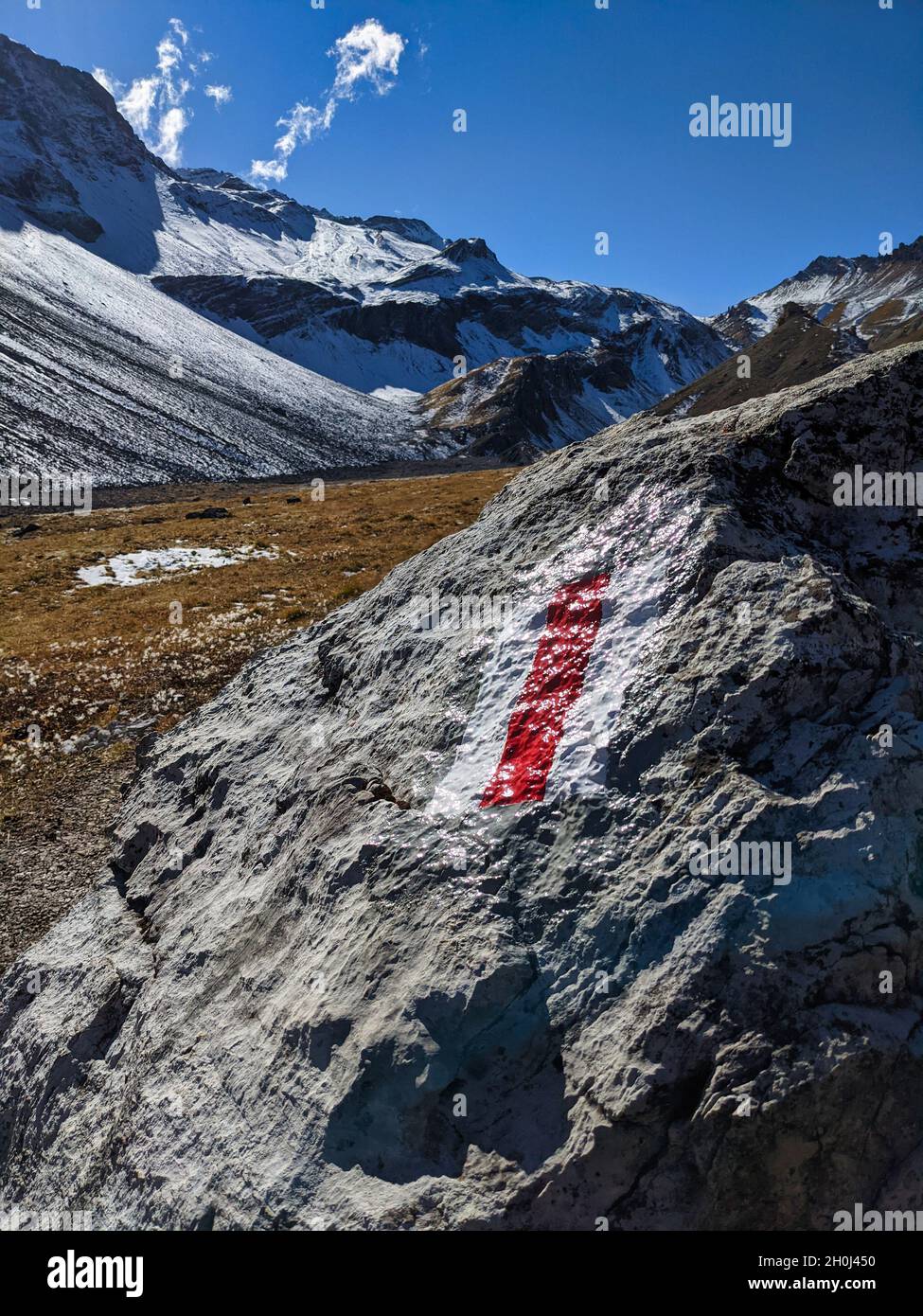 Mountain hiking trail.Hiking trails show red and white in the mountains of grisons near davos klosters. Hiking in nature Stock Photo