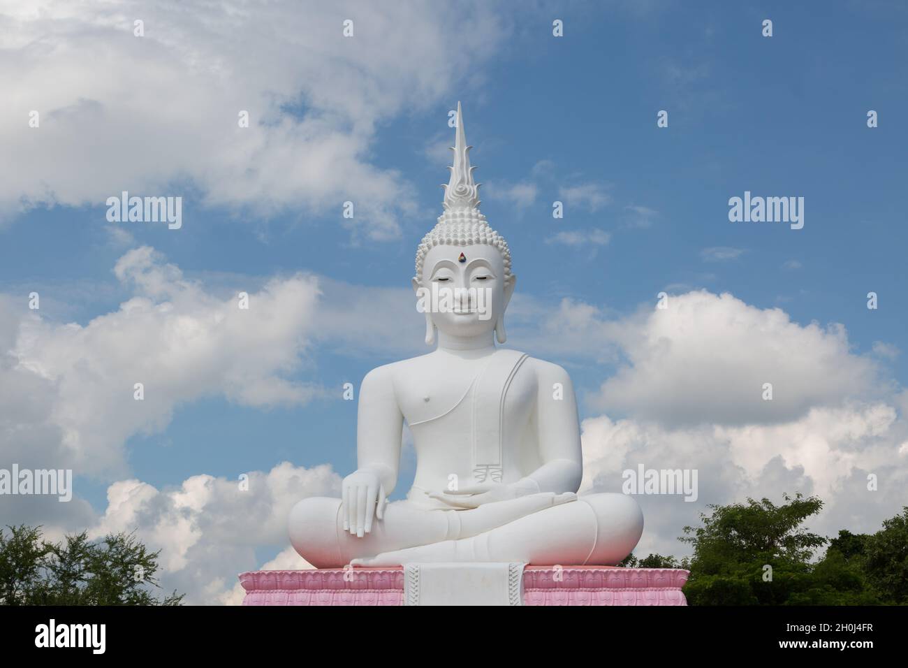 Grand White Buddha on blue sky background, The worship of the people is respected. Stock Photo