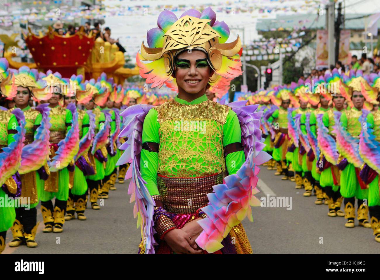 People wearing colorful costumes during the Sinulog Festival in Cebu Province. Sinulog Festival is annually celebrated at the same time as Ati-Atihan, both festivals are in honor of the infant Jesus. Philippines. Stock Photo
