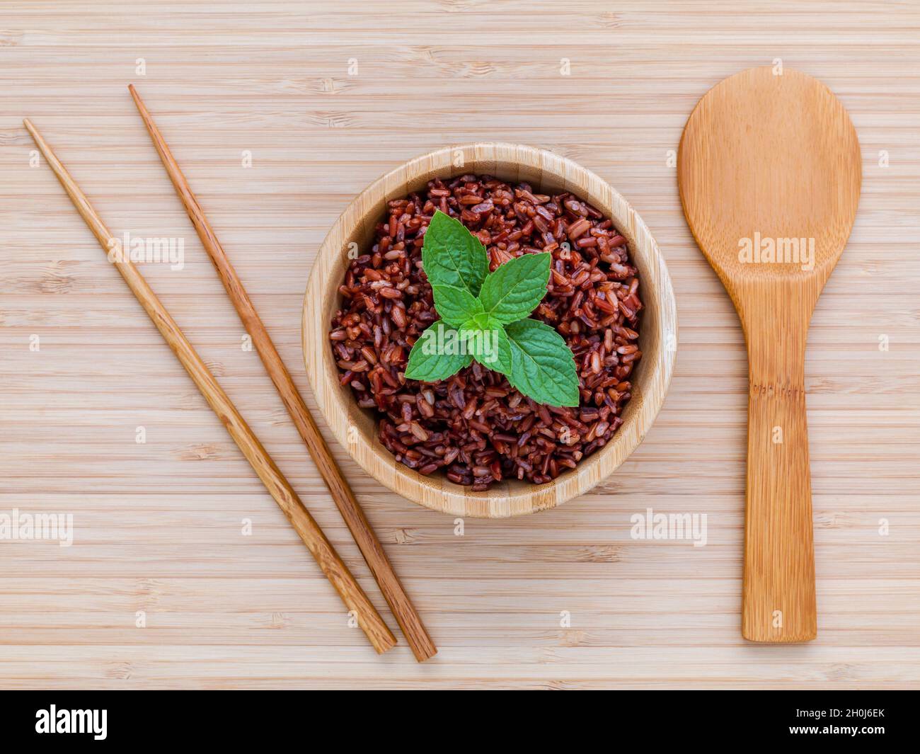 Steamed traditional thai rice in bowl with spoon hight fiber and vitamin E for dietary and healthy food. Stock Photo