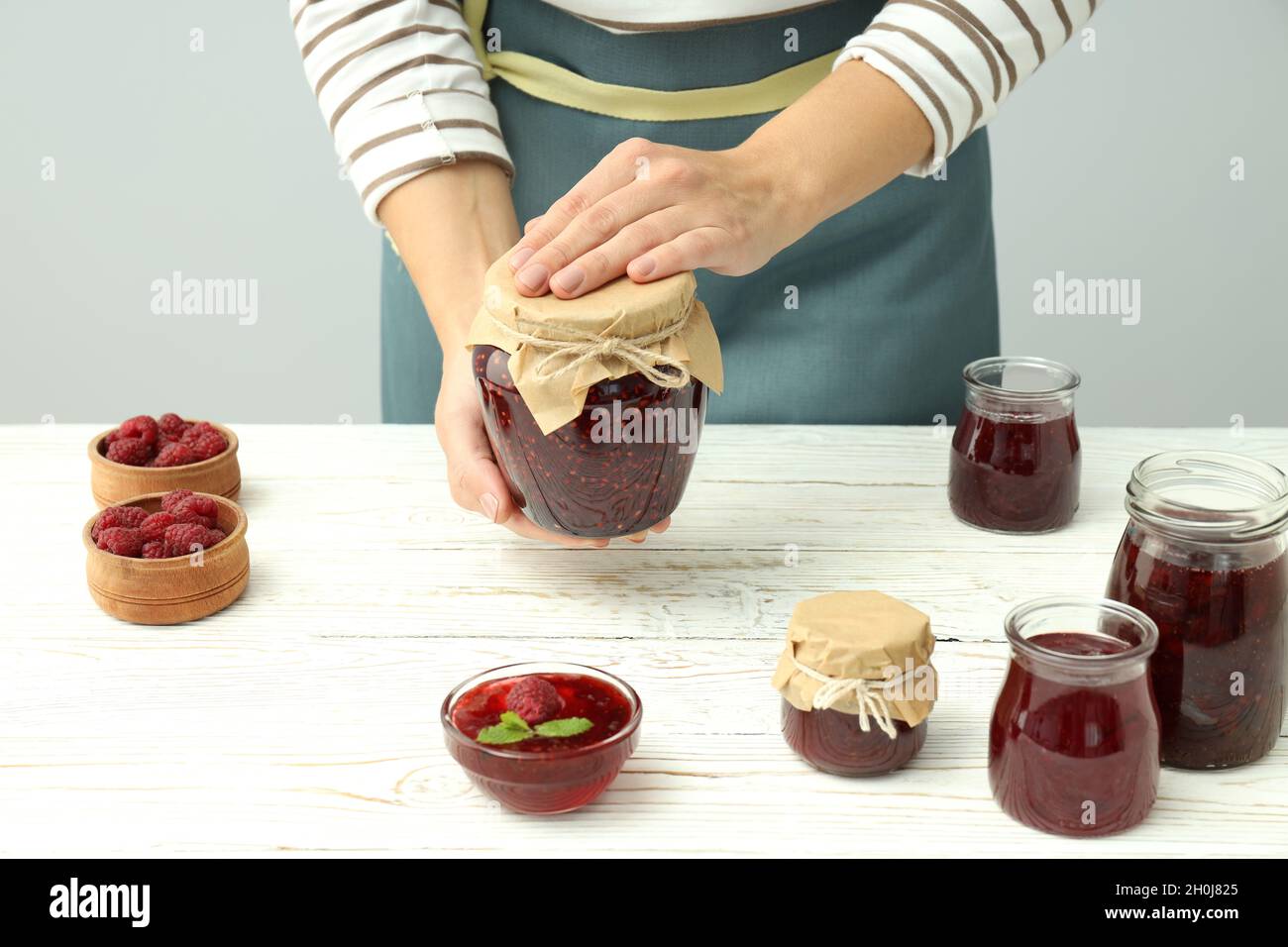 Land Cookery Raspberry Jam Concept of cooking raspberry jam on white wooden table Stock Photo - Alamy
