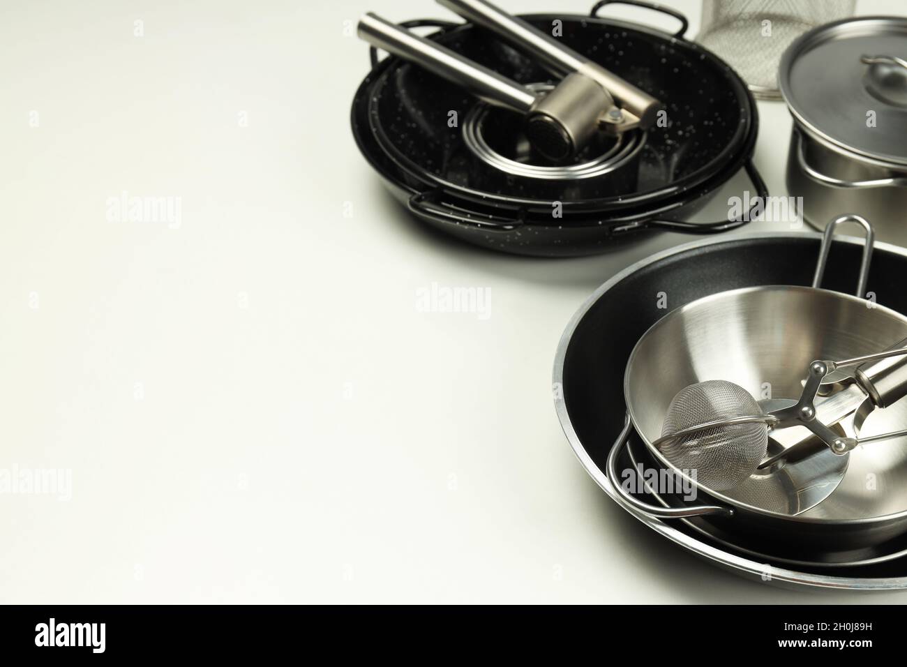 Set of different kitchen utensil on white background Stock Photo - Alamy