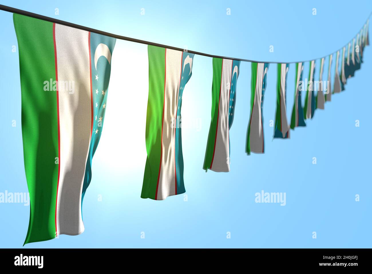wonderful many Uzbekistan flags or banners hanging diagonal on rope on ...