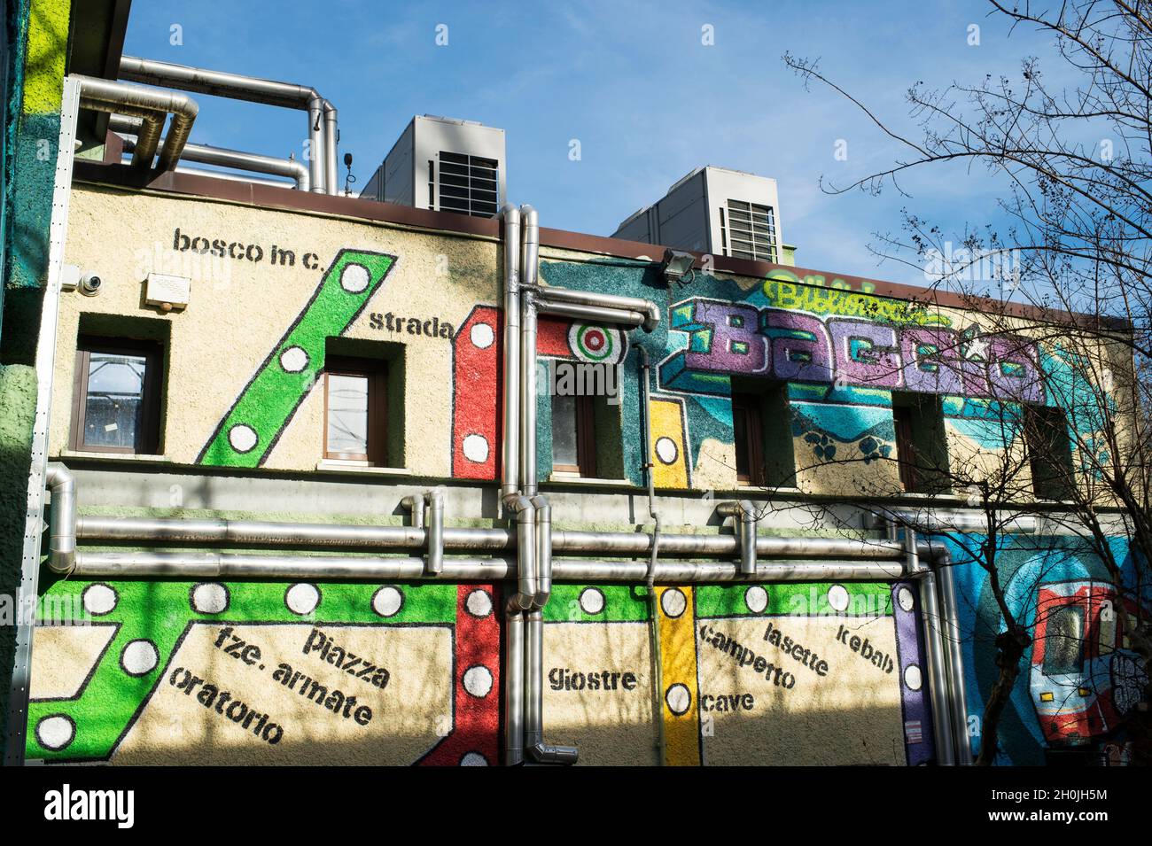 Italy, Lombardy, Milan, Baggio district, detail of the Public Library building with underground map mural Stock Photo