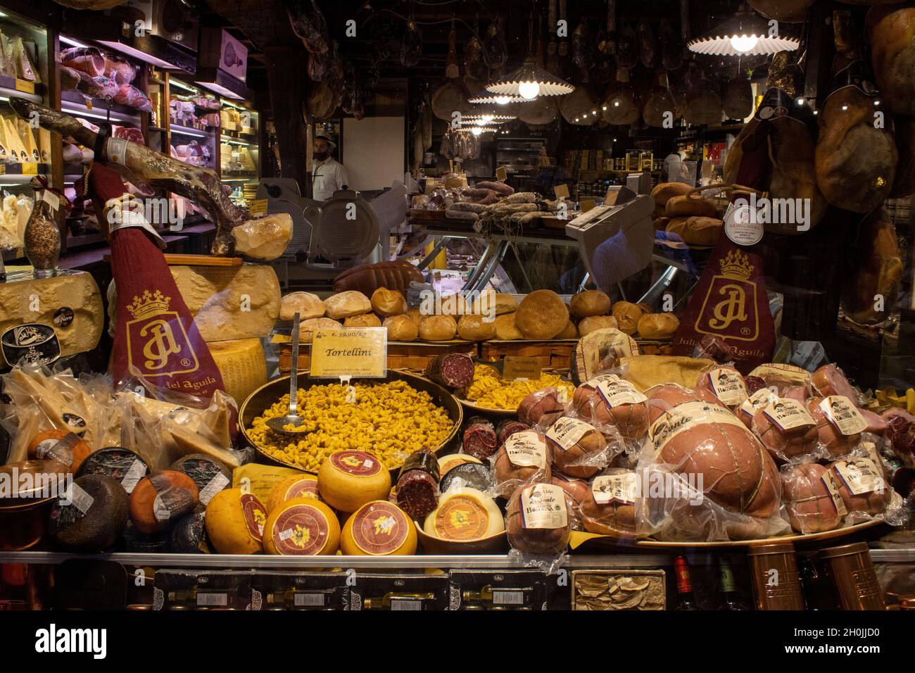An Italian delicatessen shop window full of food specialities from Bologna. 2 Stock Photo Alamy