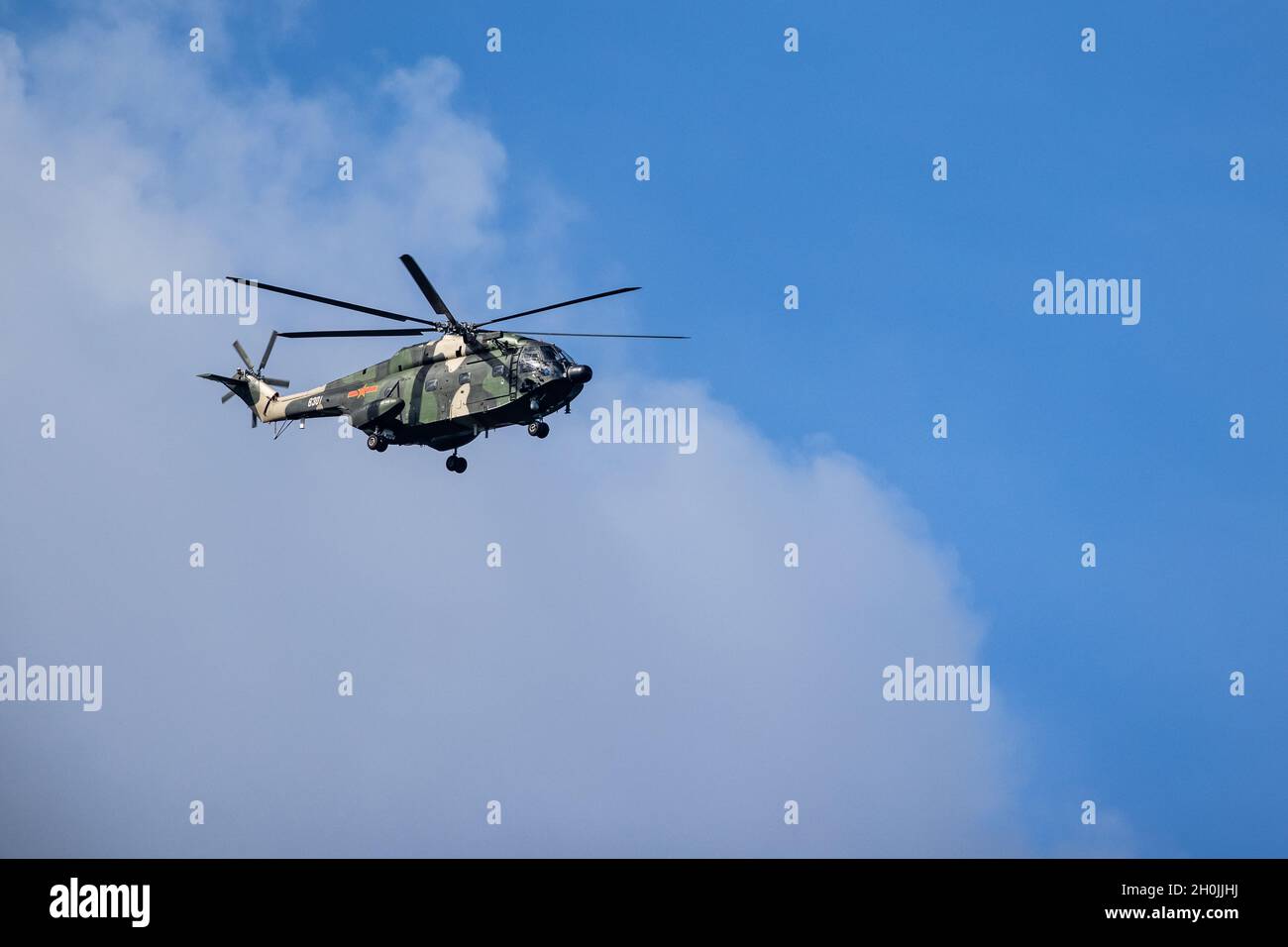 HONG KONG, CHINA - August 07, 2020: People's Liberation Army helicopters patrol over the sky of Hong Kong Stock Photo