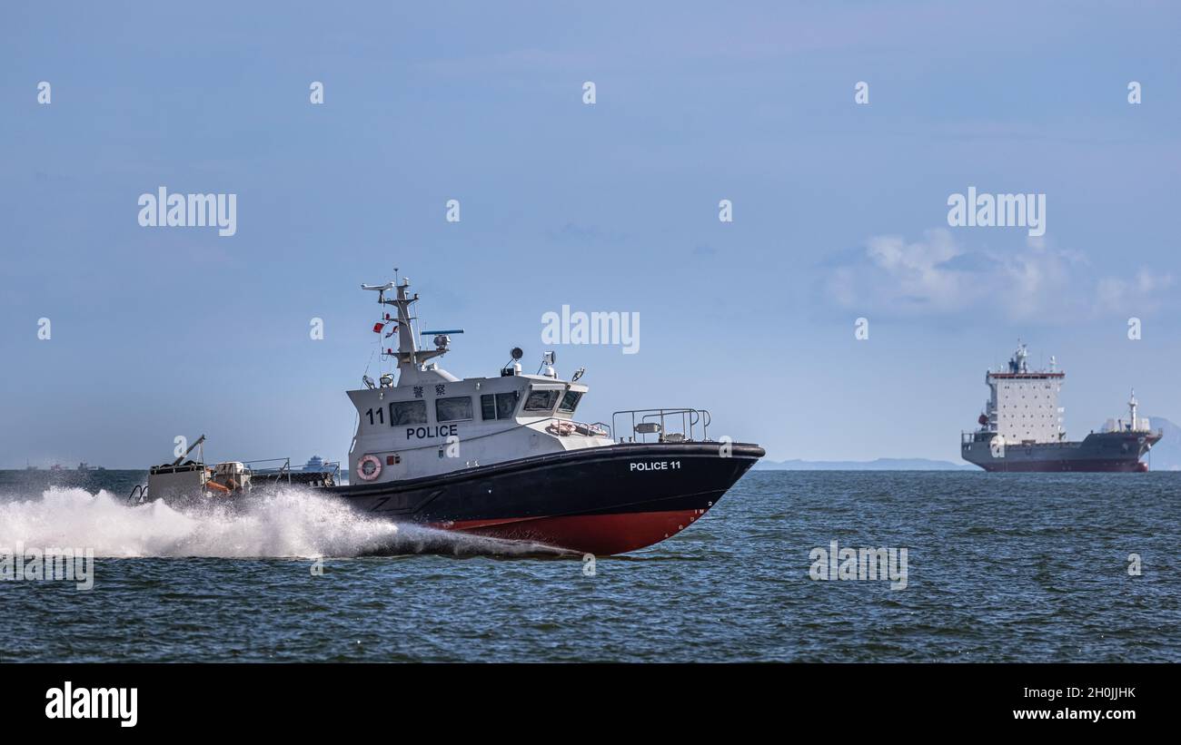 HONG KONG, CHINA - August 08, 2020: Patrol boat of Hong Kong Marine Police is patrolling the waters of Victoria Harbour Stock Photo
