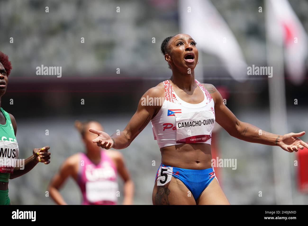 Jasmine CamachoQuinn running and winning in the final of the 100 meter hurdles at the 2020