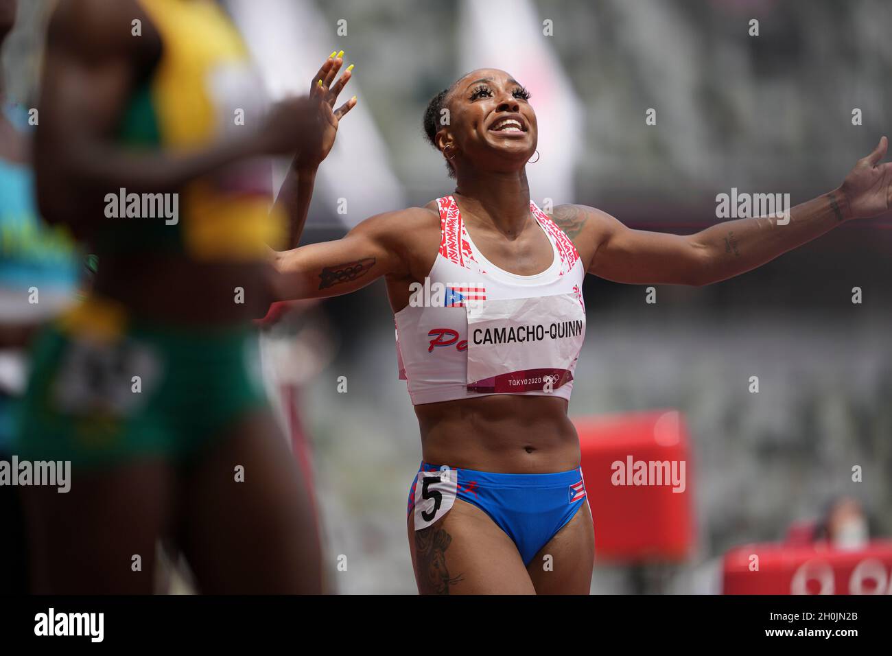 Jasmine CamachoQuinn running and winning in the final of the 100 meter hurdles at the 2020