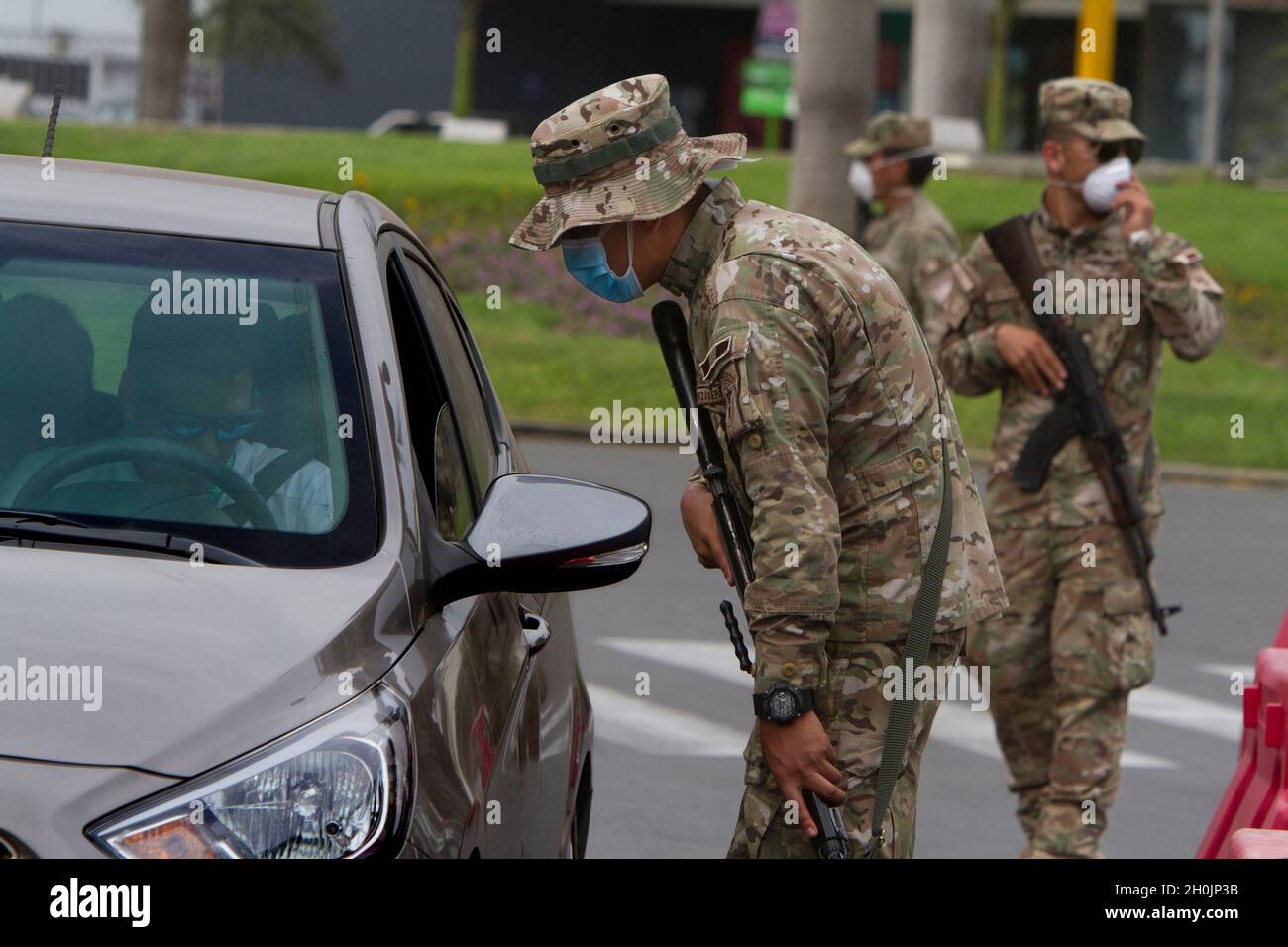 A military patrol stop a vehicle during the national state of emergency as a response to the COVID-19 pandemic in Lima, Peru. According to the Peruvian Government 33,931 people have been infected and 943 have died as of April 29, 2020. Stock Photo