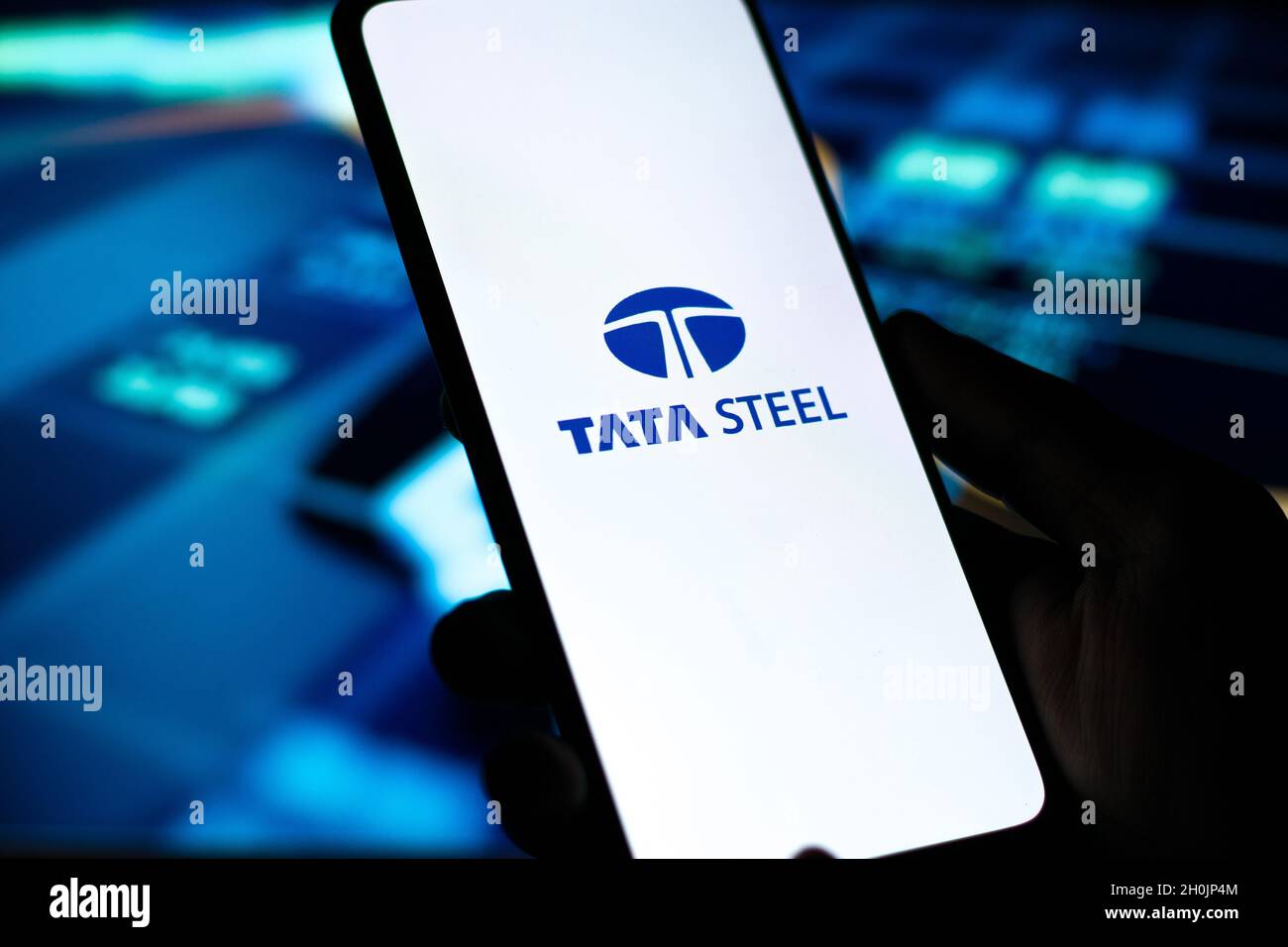 In this photo illustration, the Tata Steel logo is displayed on a