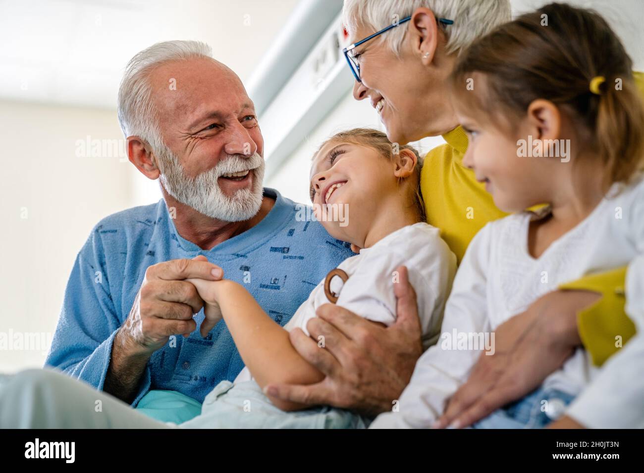 Happy Grandparents With Grandchildren On Blue Background Stock