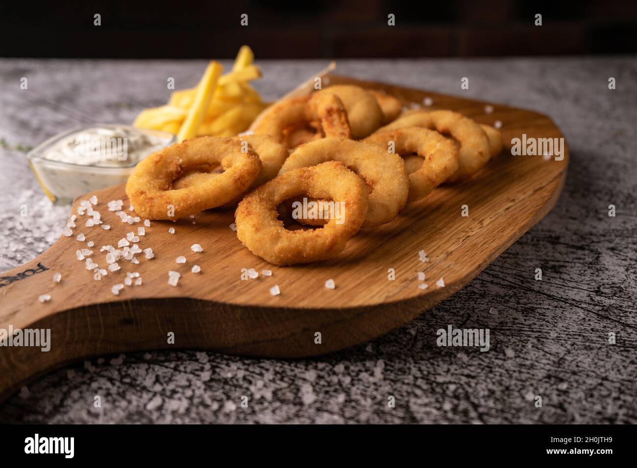 selective focus. fried onion rings in breadcrumbs fried in oil. with