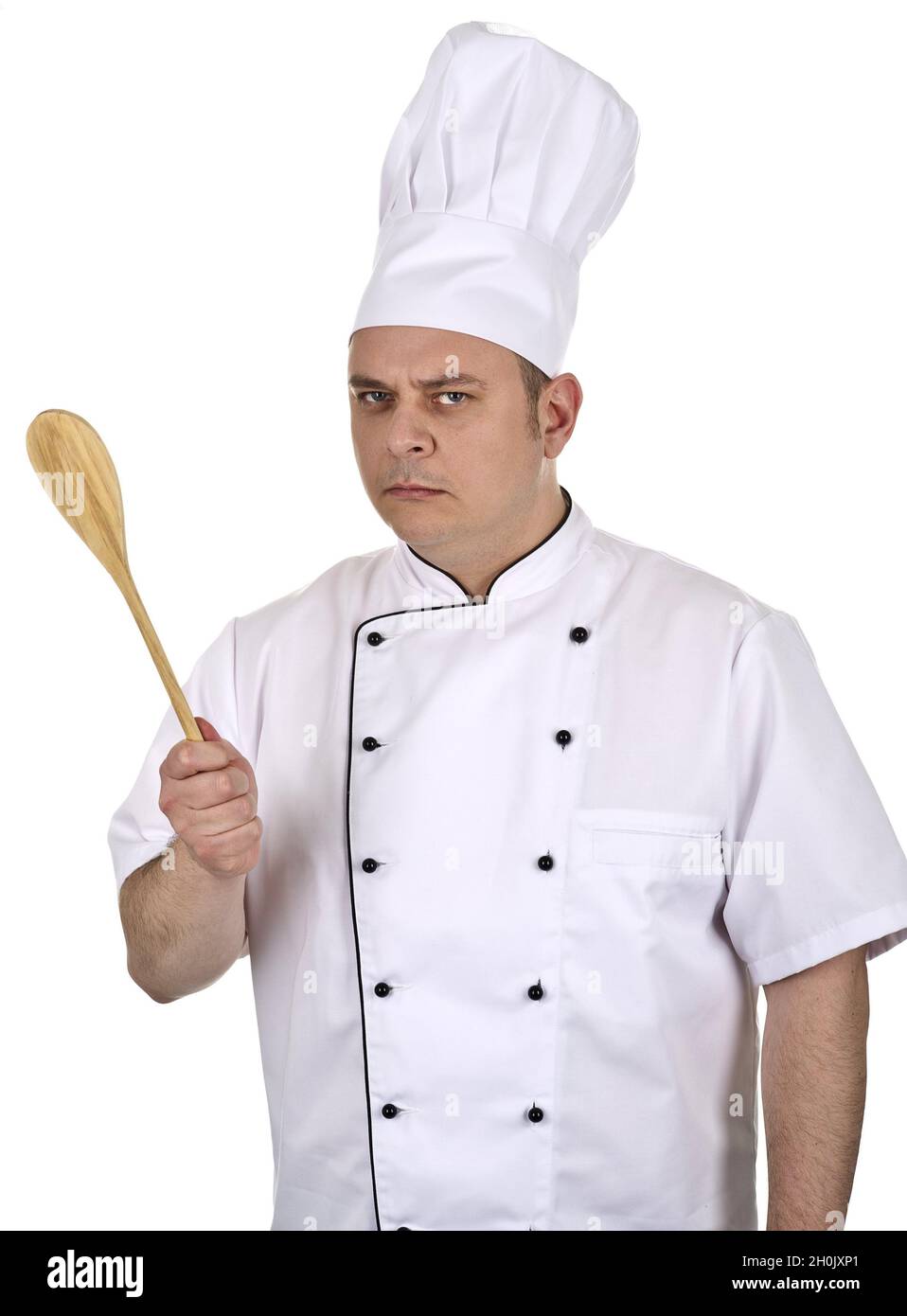 grumpy cook with wooden spoon Stock Photo Alamy