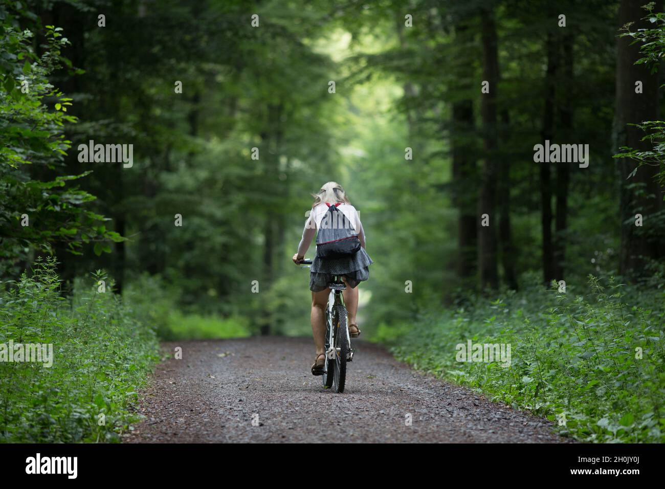 Older woman riding bicycle hi-res stock photography and images - Alamy
