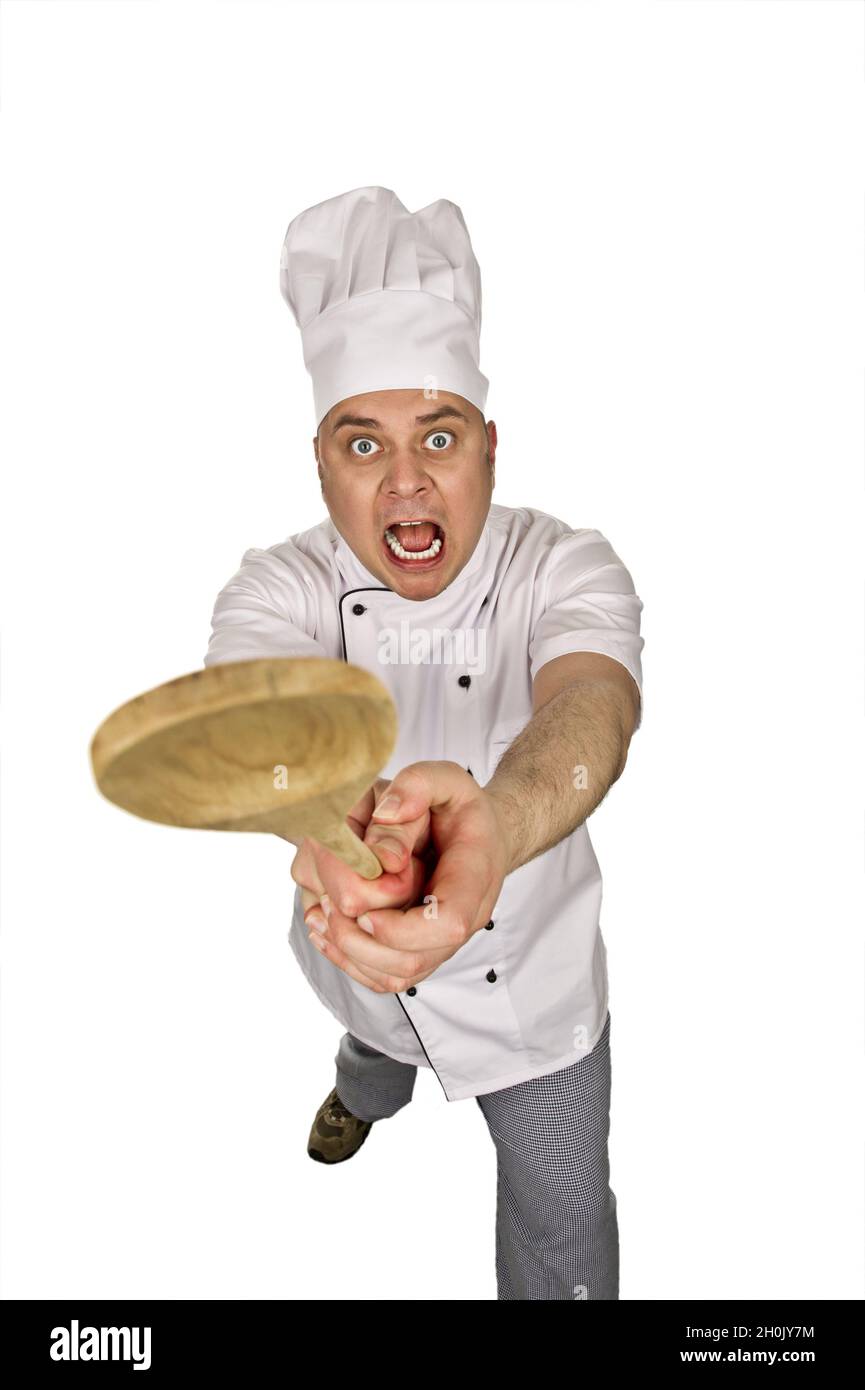 aggressive cook with wooden spoon Stock Photo - Alamy