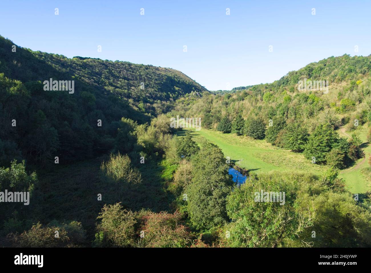 Looking down the steep sided valley of Monsal Dale from high on the Monsal Head viaduct. Stock Photo