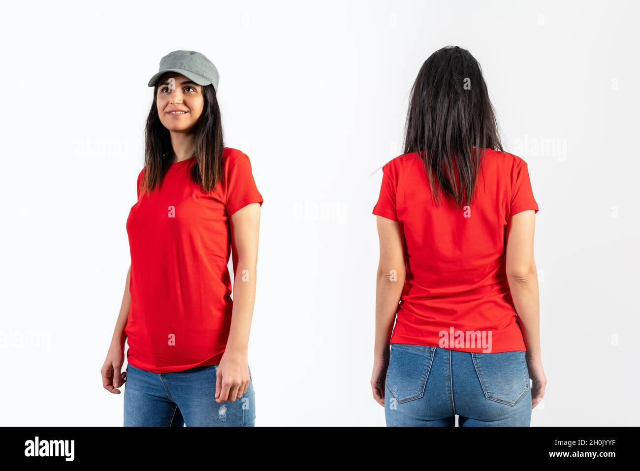 Young girl wearing blank red t-shirt, cap and blue jeans. Grey wall background . Stock Photo