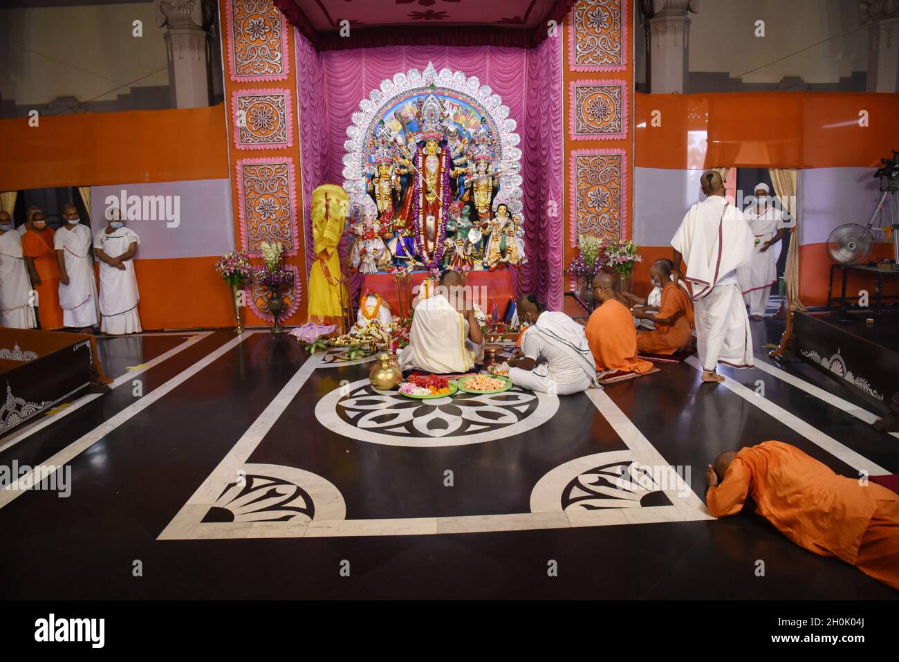 Kolkata, India. 13th Oct, 2021. Monk of Belur Math (Headquarters of  Ramakrishna Math) warring protective facemask agenst Coronavirus attend  Durga Puja during a ritual at Belur Math, about 25 kilometers (16 miles)