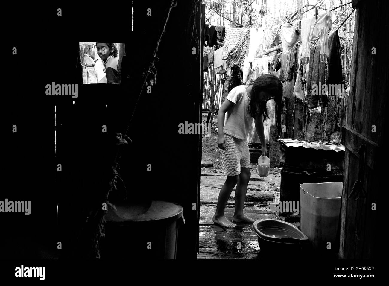 Documentary project, 'The Gulf of the Oblivion' 2005-2007..A documentary project about the poor population that live in the islands of the Gulf of Guayaquil. Image of a washing area outside a local home. Ecuador. Stock Photo