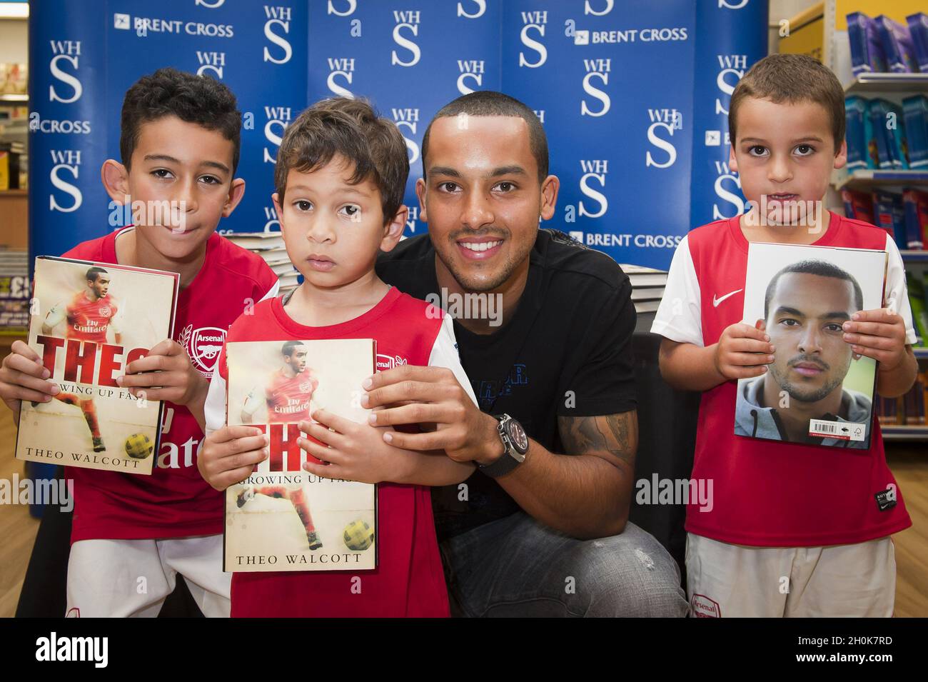 Theo Walcott signs copies of his autobiography 'Theo: Growing up Fast