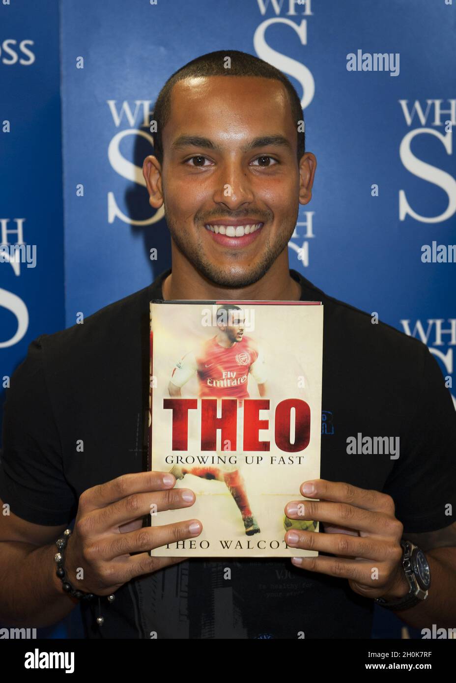 Theo Walcott signs copies of his autobiography 'Theo: Growing up Fast