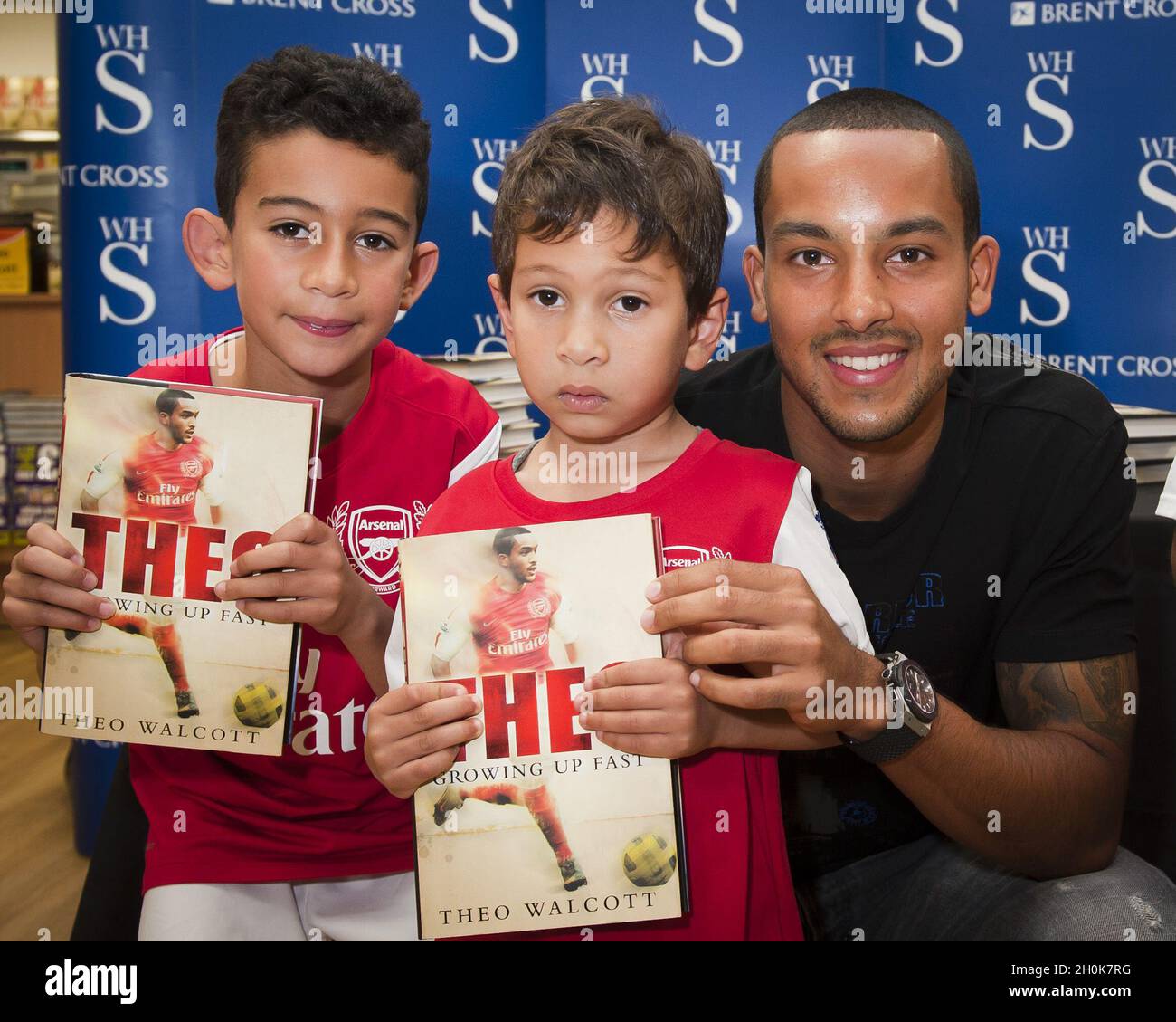 Theo Walcott signs copies of his autobiography 'Theo: Growing up Fast