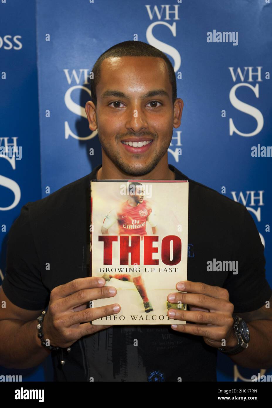 Theo Walcott signs copies of his autobiography 'Theo: Growing up Fast