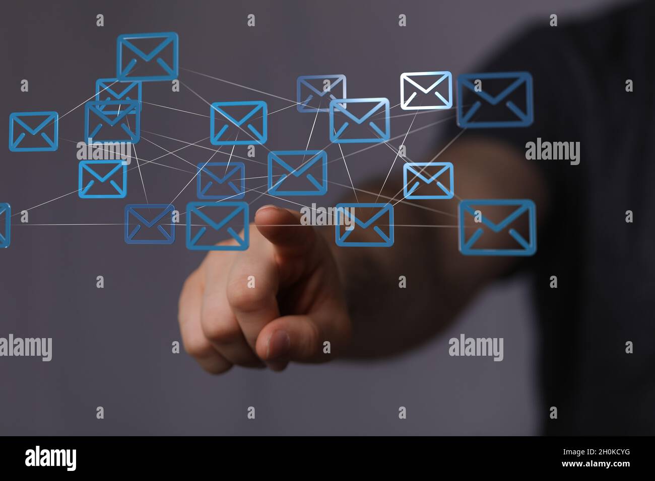 3D rendering of a businessman pointing at floating email icons against ...