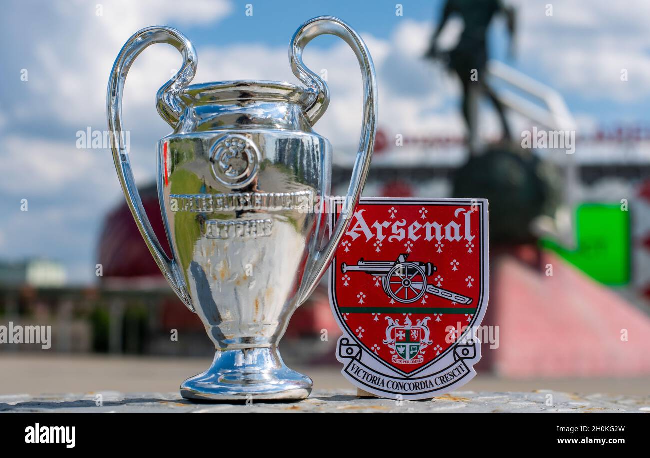 June 14 21 London Uk Arsenal F C Football Club Emblem And The Uefa Champions League Cup Against The Backdrop Of A Modern Stadium Stock Photo Alamy