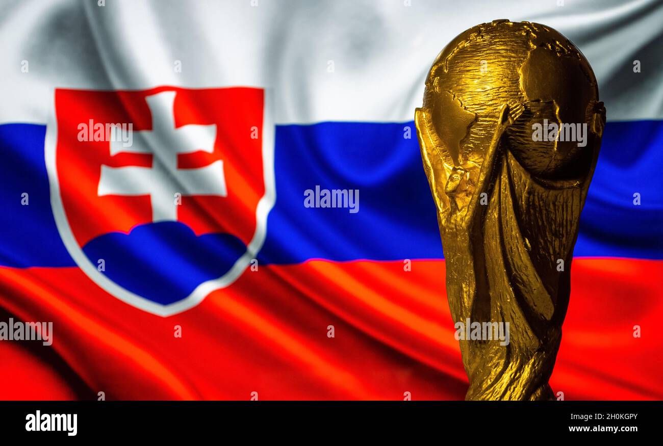 October 6, 2021 Bratislava, Slovakia. FIFA World Cup against the background of the flag of Slovakia. Stock Photo