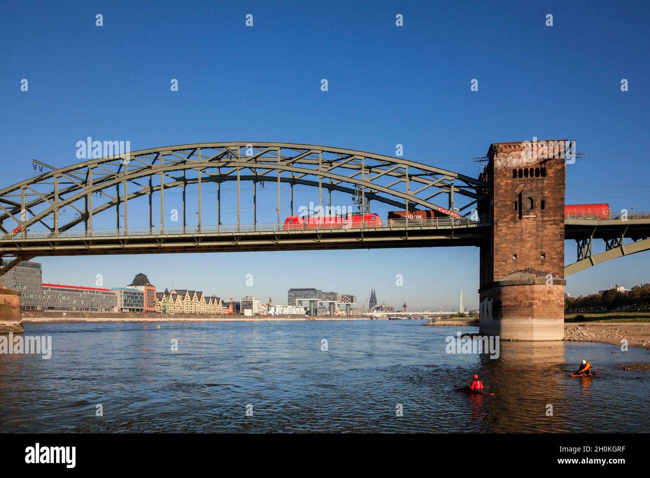 view from below the Suedbruecke to the Rheinau harbor with the Crane Houses and to the cathedral, kayakers, Cologne, Germany.  Blick von unterhalb der Stock Photo
