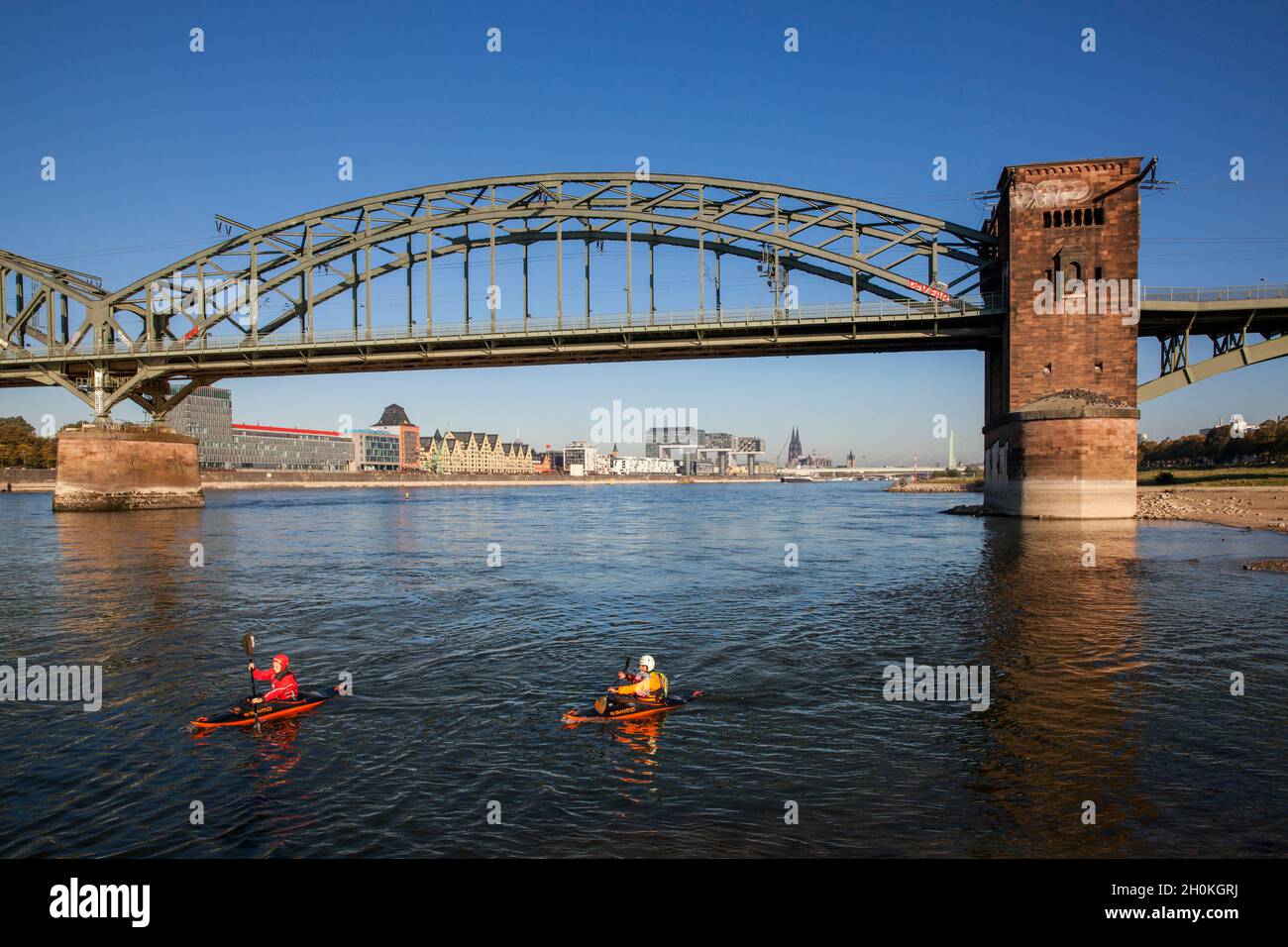 view from below the Suedbruecke to the Rheinau harbor with the Crane Houses and to the cathedral, kayakers, Cologne, Germany.  Blick von unterhalb der Stock Photo