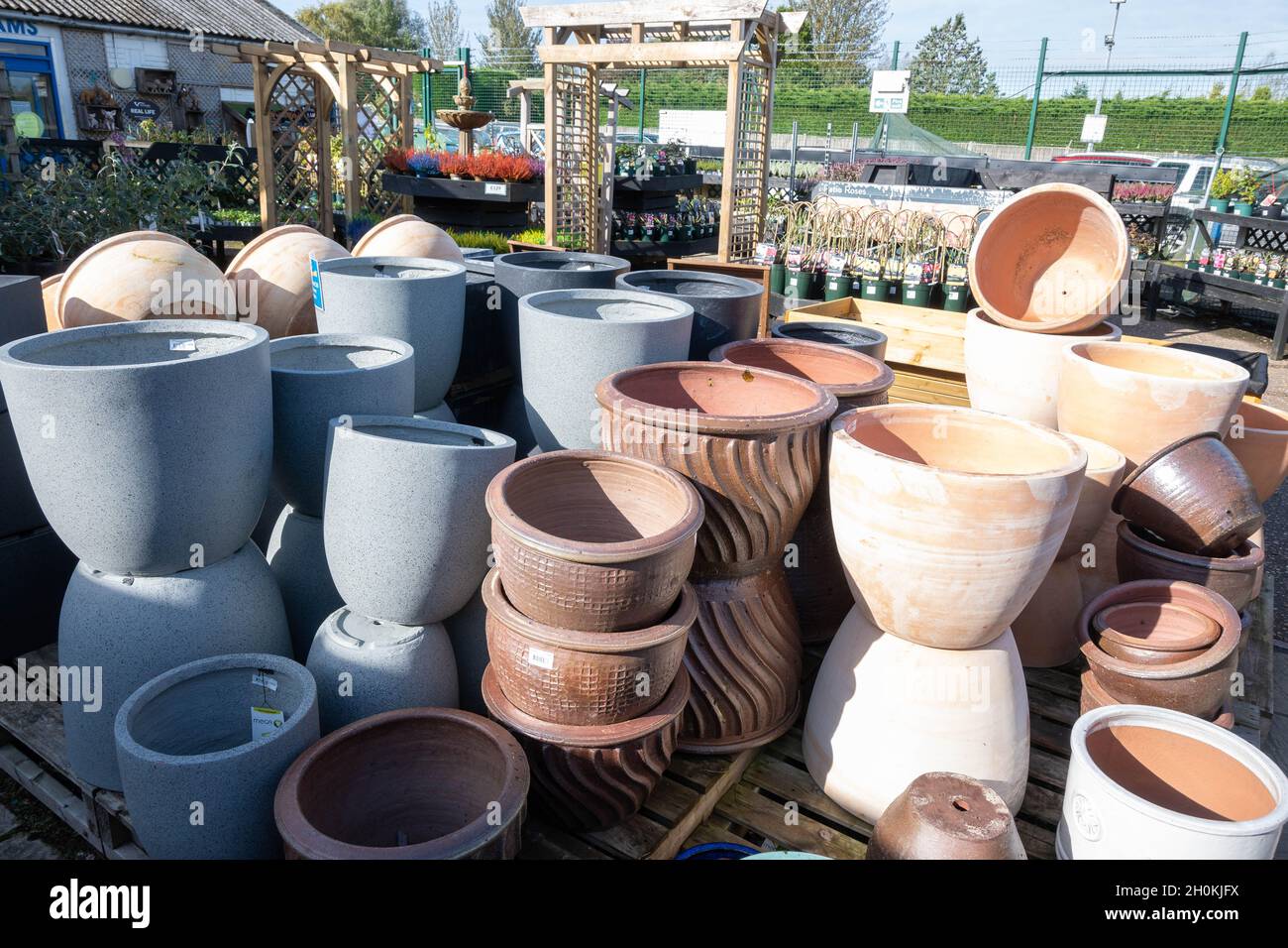 A view of garden pots and plants at a garden centre in norfolk England