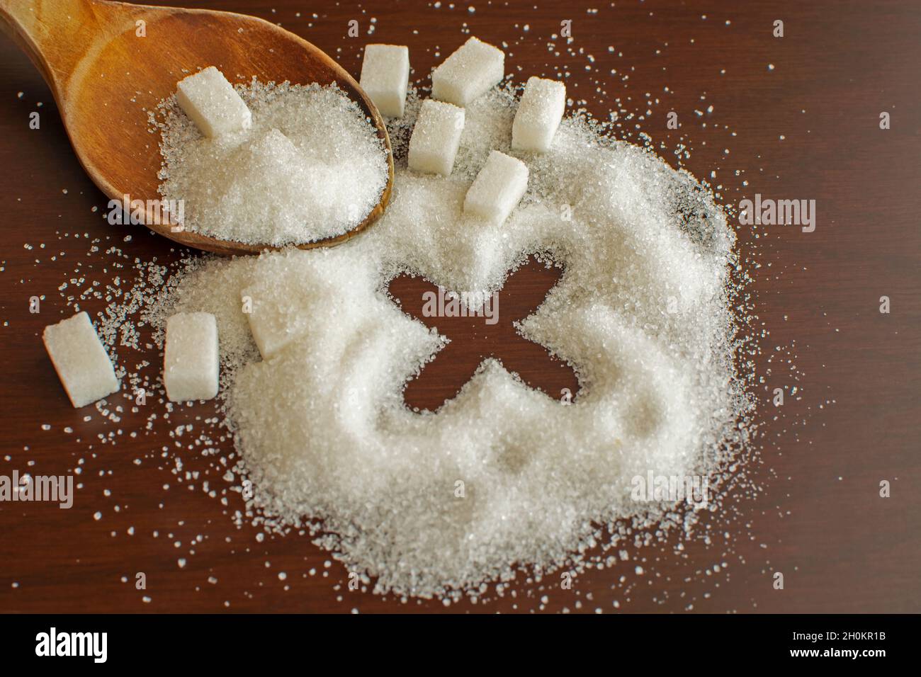 Stop sign sugar warns that too much sugar will make an unhealthy diet, obesity, diabetes, dental care and much more. Stock Photo