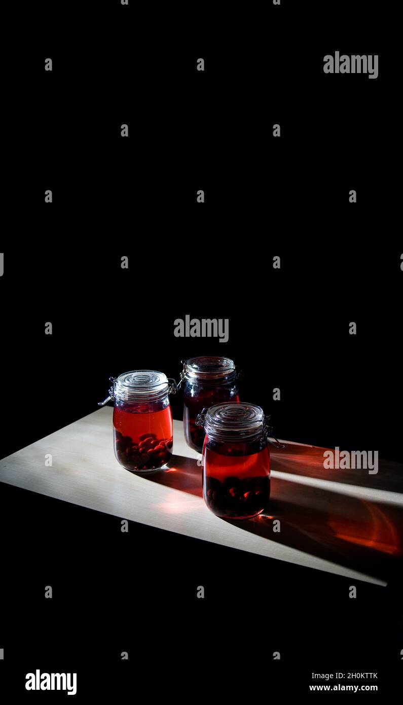 Home made sloe gin maturing and fermenting in kilner jars Stock Photo Alamy