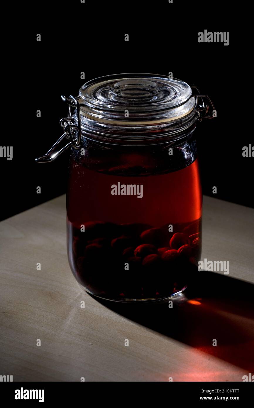 Home made sloe gin maturing and fermenting in kilner jars Stock Photo Alamy