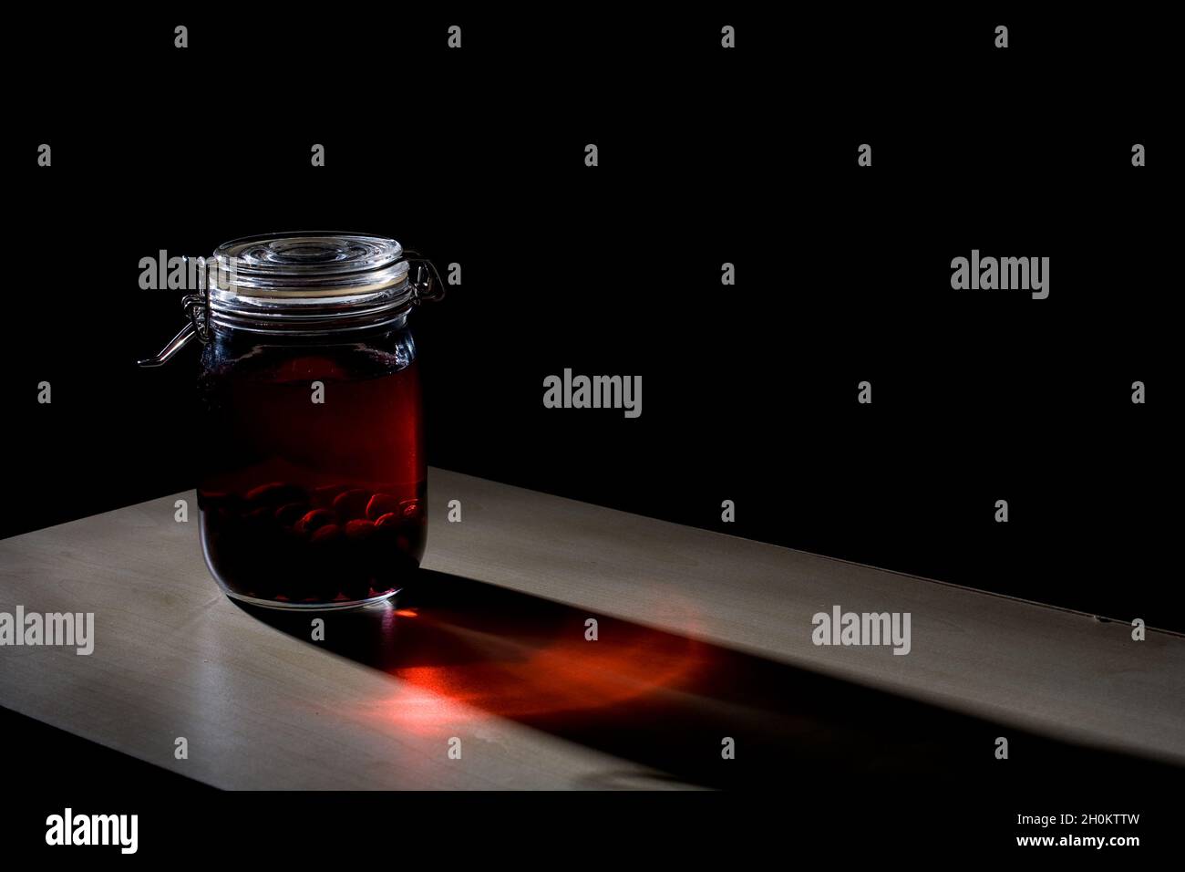 Home made sloe gin maturing and fermenting in kilner jars Stock Photo Alamy