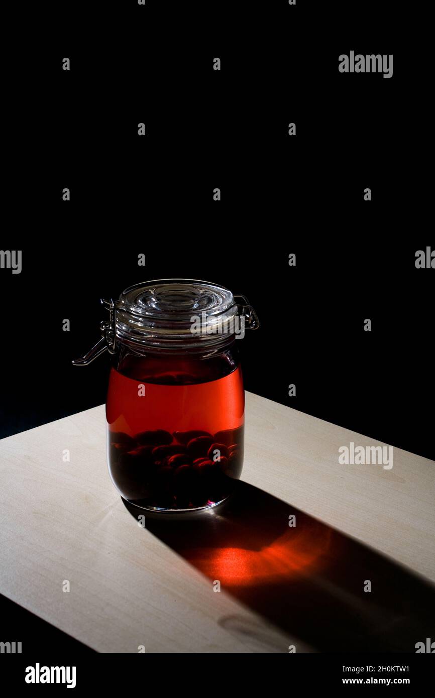 Home made sloe gin maturing and fermenting in kilner jars Stock Photo Alamy