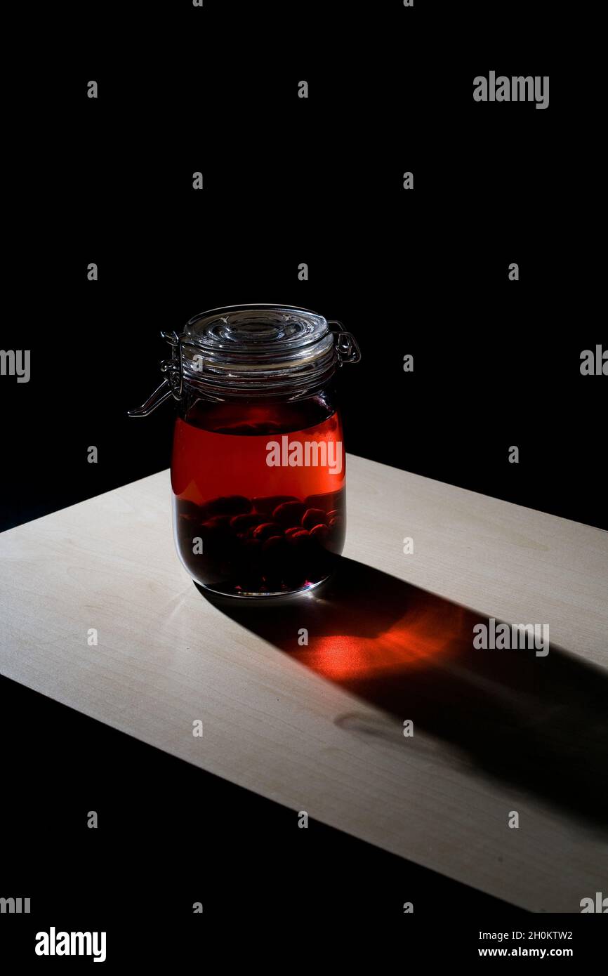 Home made sloe gin maturing and fermenting in kilner jars Stock Photo Alamy