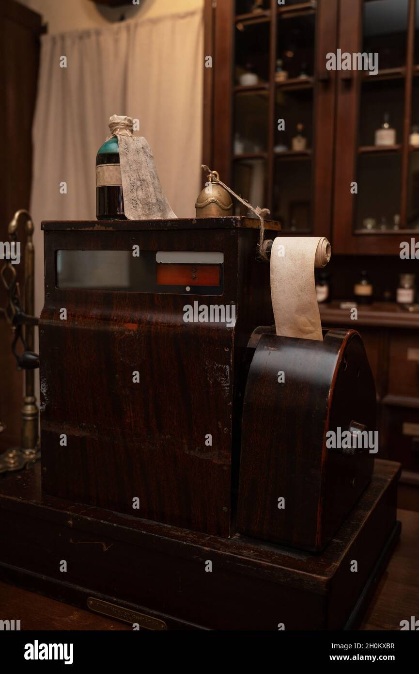 Vintage cash register in old pharmacy. Wooden antique furniture for ...