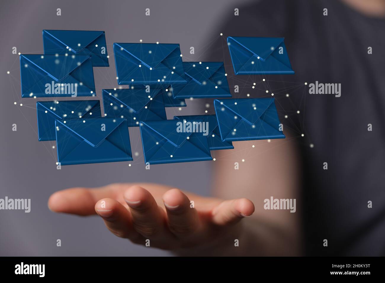3D rendering of blue email inbox icons floating on a businessman's hand ...