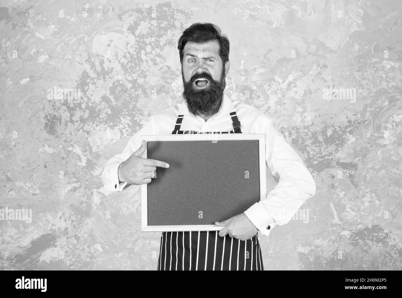 Man pointing finger at board Black and White Stock Photos & Images - Alamy