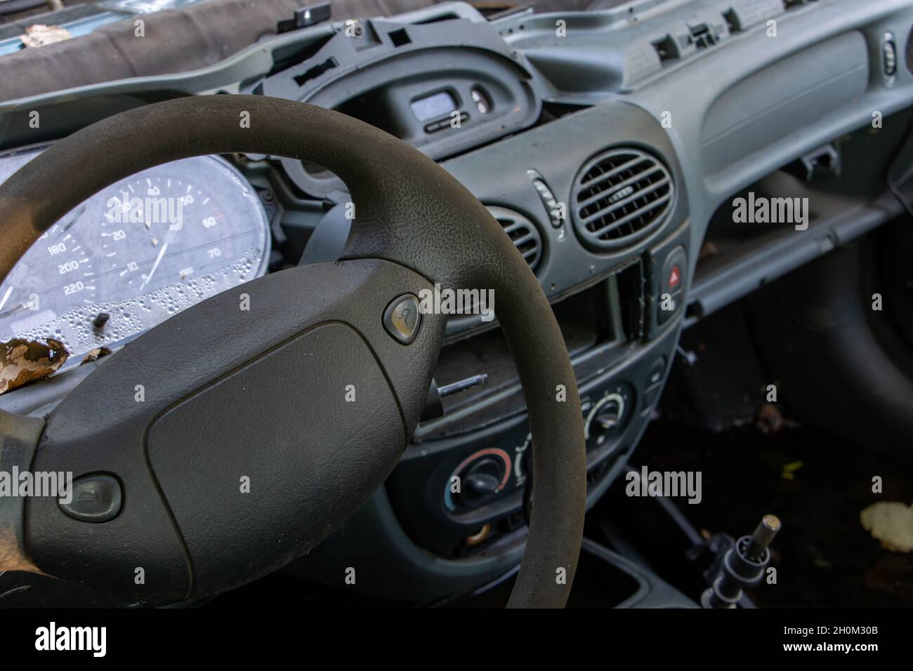 A steering wheel with dashboard of damaged car Stock Photo Alamy