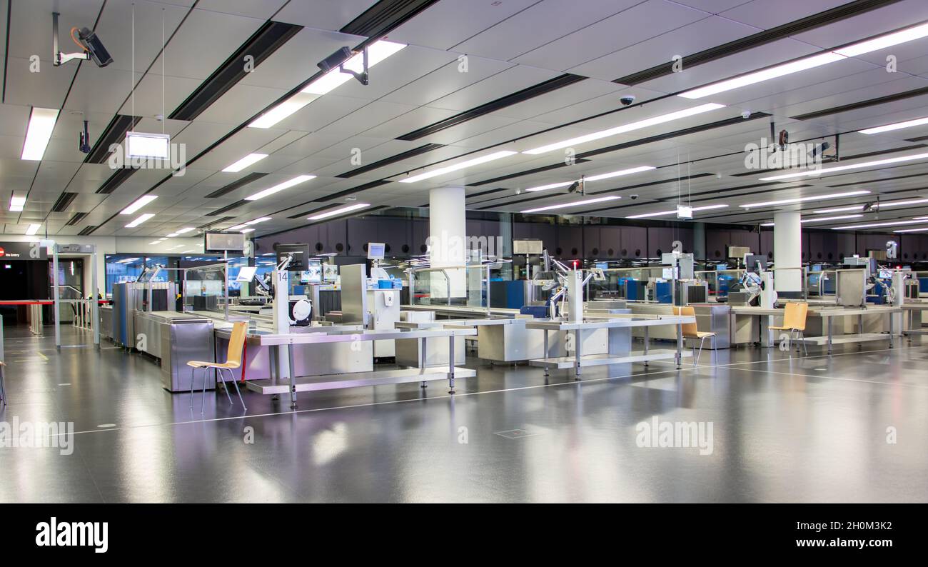 The empty hall with a counters for check luggage at the airport Stock Photo
