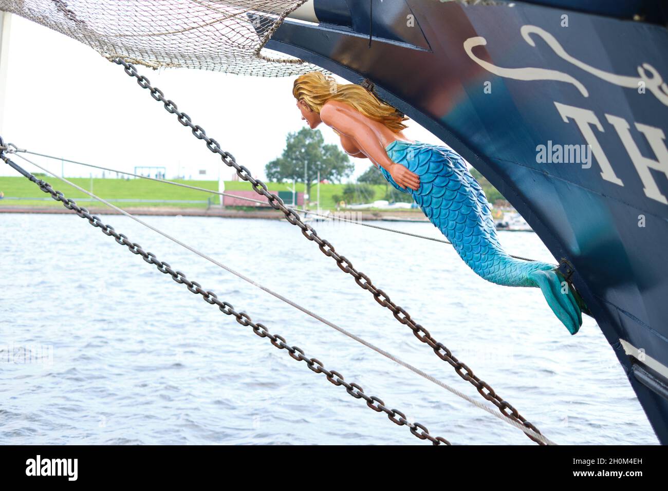 Mermaid stature as a figurehead at the front of a sailing ship Stock