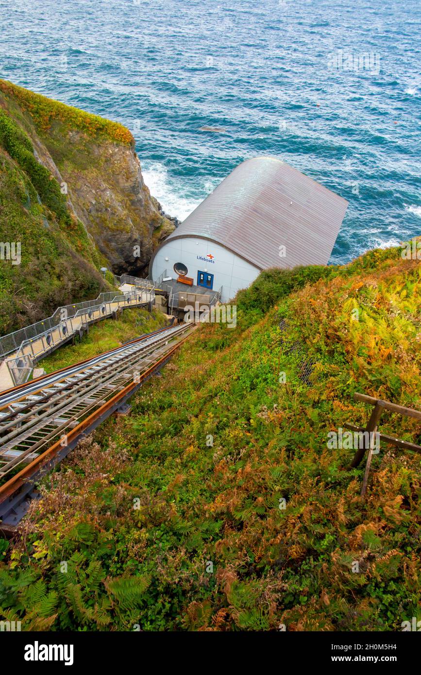 Funicular railway leading to the Lizard RNLI Lifeboat Station at the foot of cliffs on the Lizard in south west Cornwall England UK Stock Photo