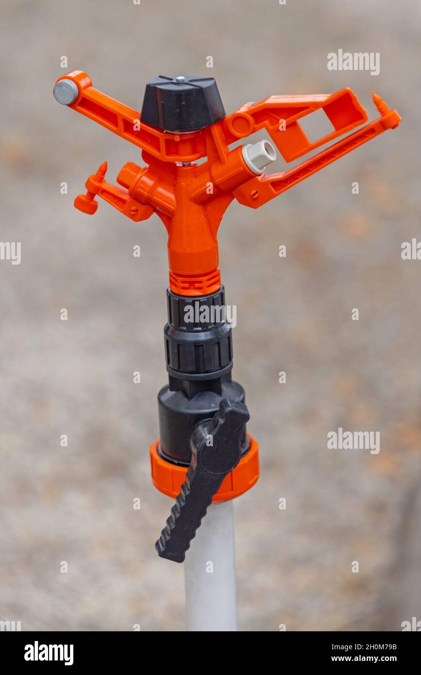 New Orange Water Sprinkler for Agriculture Modern Farms Stock Photo Alamy