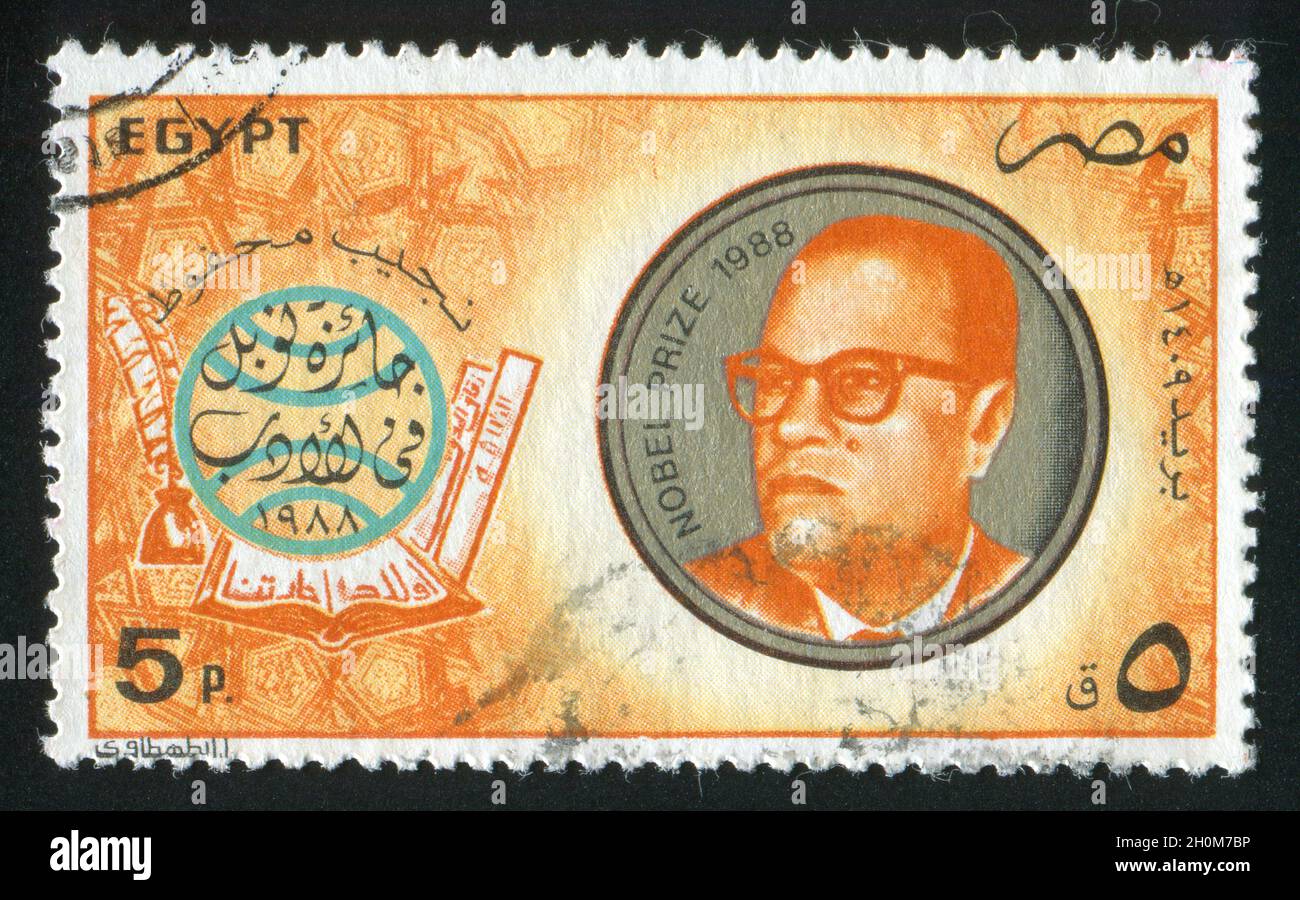 EGYPT CIRCA 1988 Stamp Printed By Egypt Shows Globe Books Naguib egypt-circa-1988-stamp-printed-by-egypt-shows-globe-books-naguib